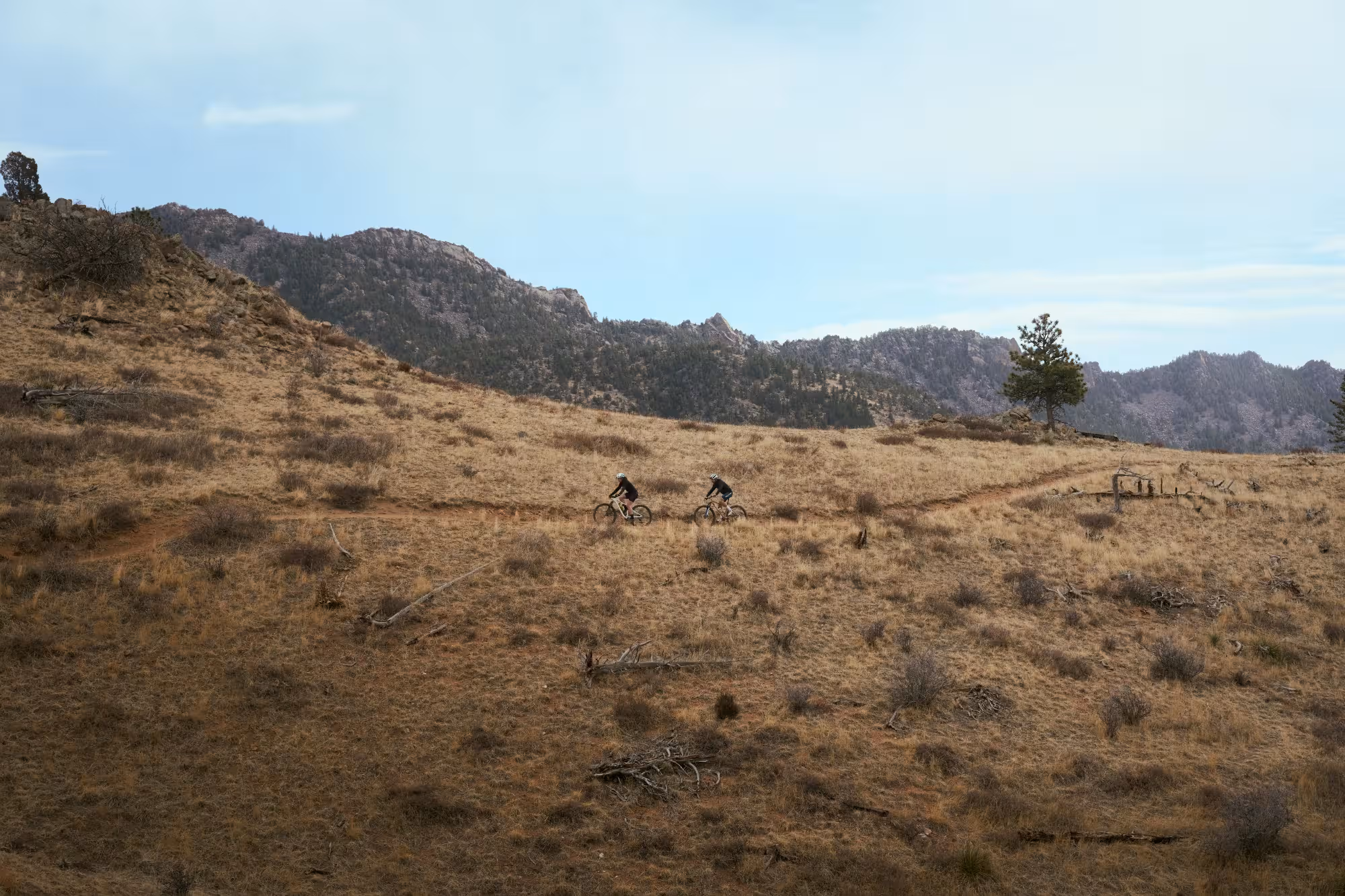 Photography of mountain bikers riding through the Boulder mountains